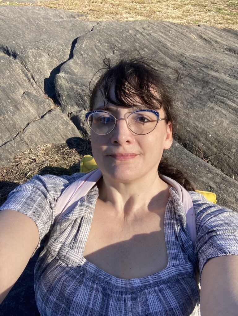 Selfie against sunlit schist 