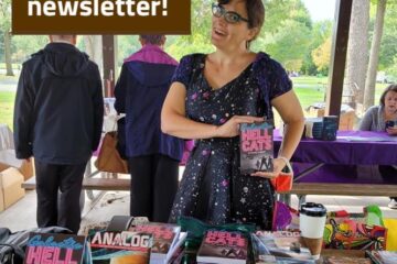 Woman at table holds up book with text Join my author newsletter, get free stuff!
