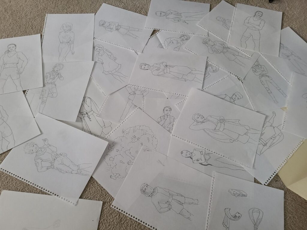 many black and white drawings on torn spiral sheets laid out on a beige carpet 