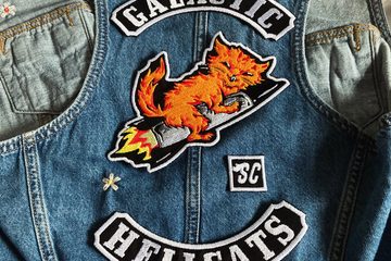 Galactic Hellcats logo and text in embroidered patches on the back of a denim vest
